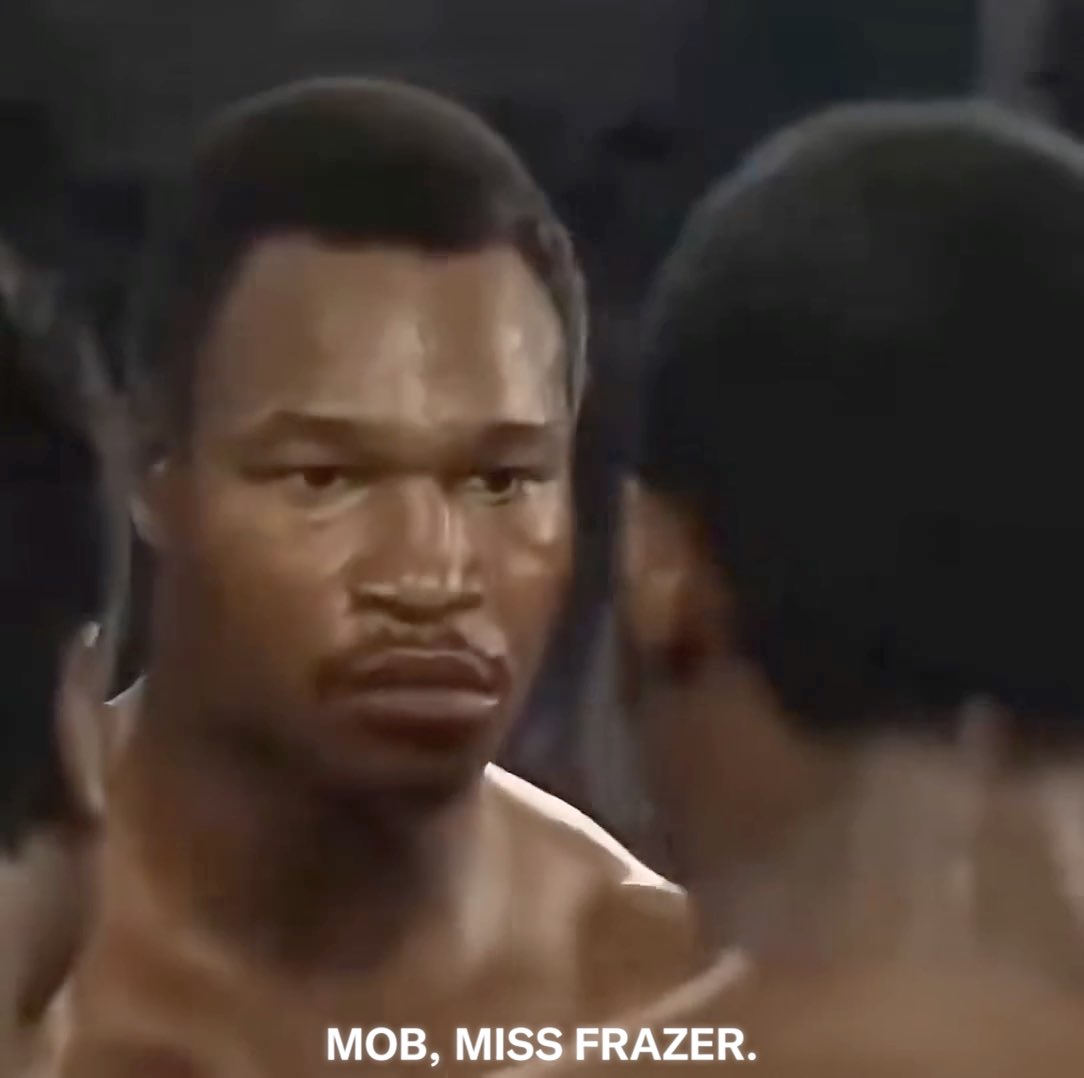 He’s still punching, but he’s looking at Mills Lane and waving him in. The fight was over before the referee called it. Larry Holmes was 44-0. Marvis Frazier was 10-0. The WBC still wouldn’t sanction it as a title fight. Holmes was the WBC heavyweight champion and had already made 16 successful defenses. Marvis was unbeaten, but he had only 10 pro fights and wasn’t ranked in the WBC top 10. That mattered. If Marvis had won, Holmes would have lost the belt, but Frazier still wouldn’t have been recognized as WBC champion. Holmes was a 4-to-1 favorite. Once it started, the experience gap showed immediately. He dropped Frazier with a jab-right hand, trapped him in the corner, and unloaded. Marvis entered unbeaten. Less than one round later, people were asking whether he had been pushed into this level too soon. Caesars Palace, Las Vegas. November 25, 1983. #Boxing #BoxingHistory