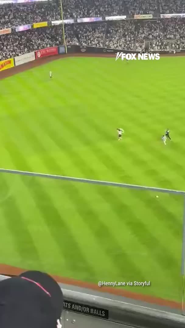 A man waving a Palestinian flag storms the field at Yankee Stadium during the Yankees-Mets game on the 25th anniversary of 9/11. Video shows security chasing him down and tackling him as fans reportedly throw beer cans while he is escorted away. The disruption happened around 9:11 p.m. before the Yankees beat the Mets 6-4.
