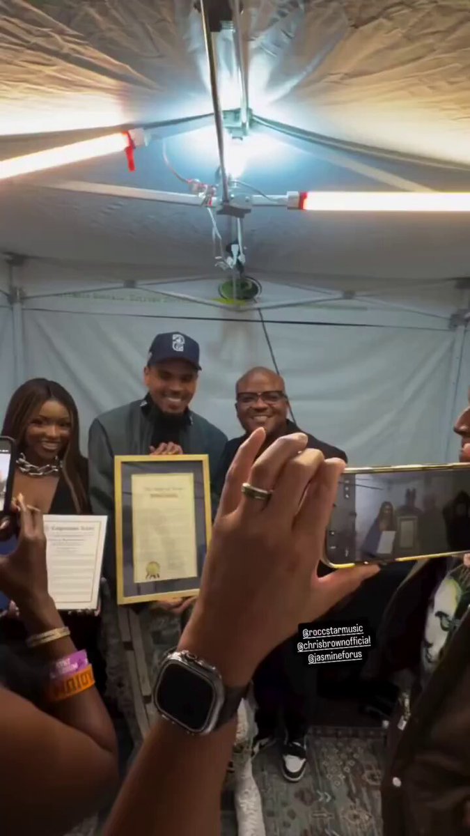 Chris Brown poses alongside representatives from Congresswoman Jasmine Crockett’s office after receiving an official State of Texas certificate backstage at last night’s R&amp;B Tour stop in Dallas.
