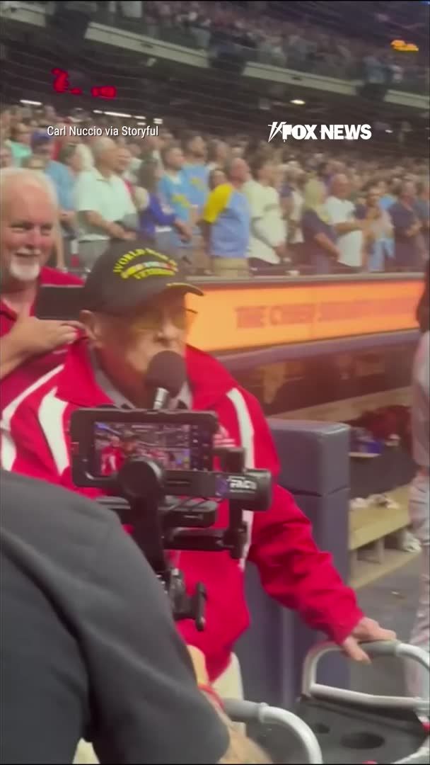 A 102-year-old World War II veteran brings the crowd to its feet with a stirring rendition of "God Bless America" at a Milwaukee Brewers game as the nation marked 25 years since the 9/11 terrorist attacks. Navy veteran Sverre Vinje receives a standing ovation as fans erupt into cheers and chant "USA!" following his performance.