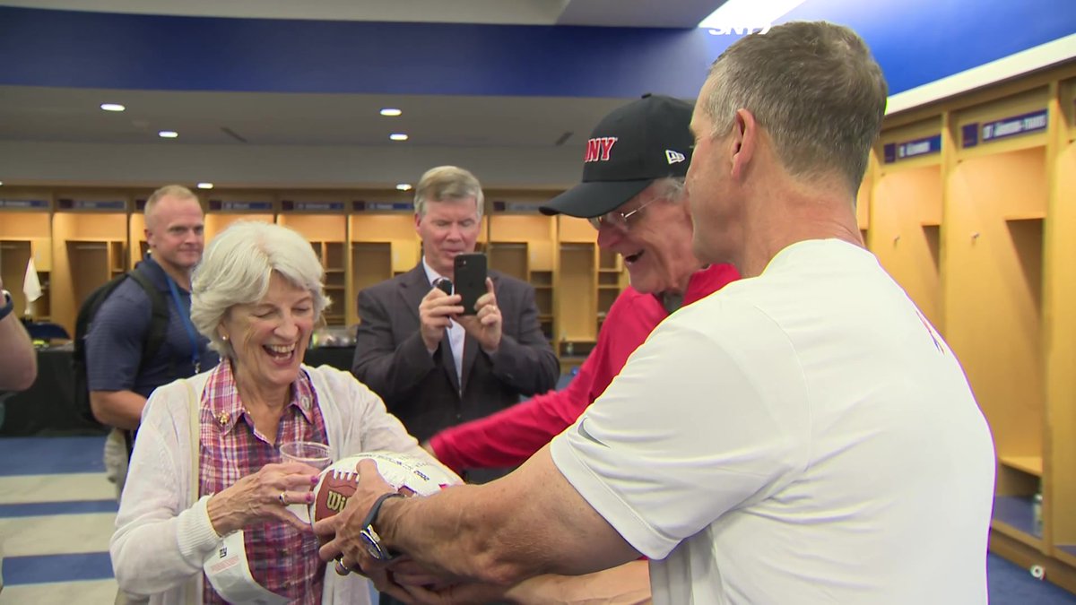 The Harbaughs celebrate the victory! John Harbaugh gave his father a game ball from Western Kentucky's 2002 championship