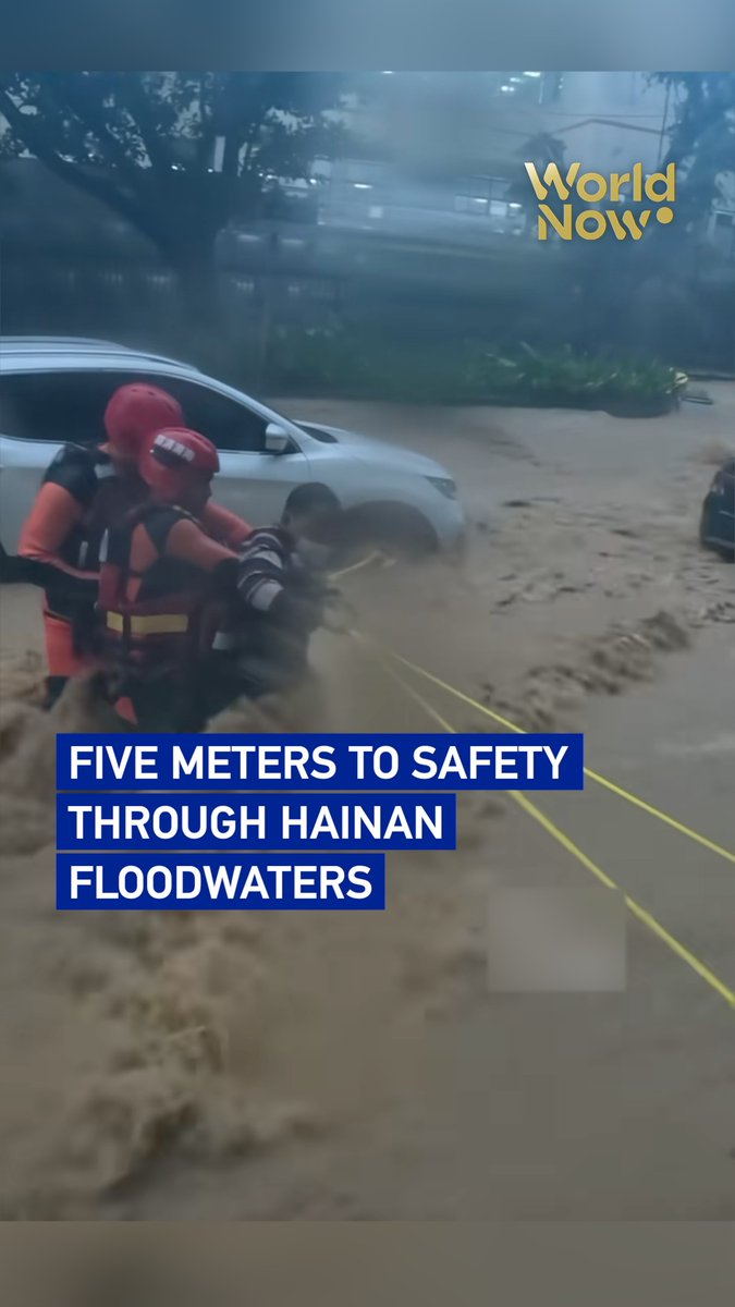 Stranded residents struggled across a flooded road in Tongshi Town, Wuzhishan, south China's Hainan Province. Firefighters used ropes to help them cross the five meters to safety amid record rainfall. #WorldNow