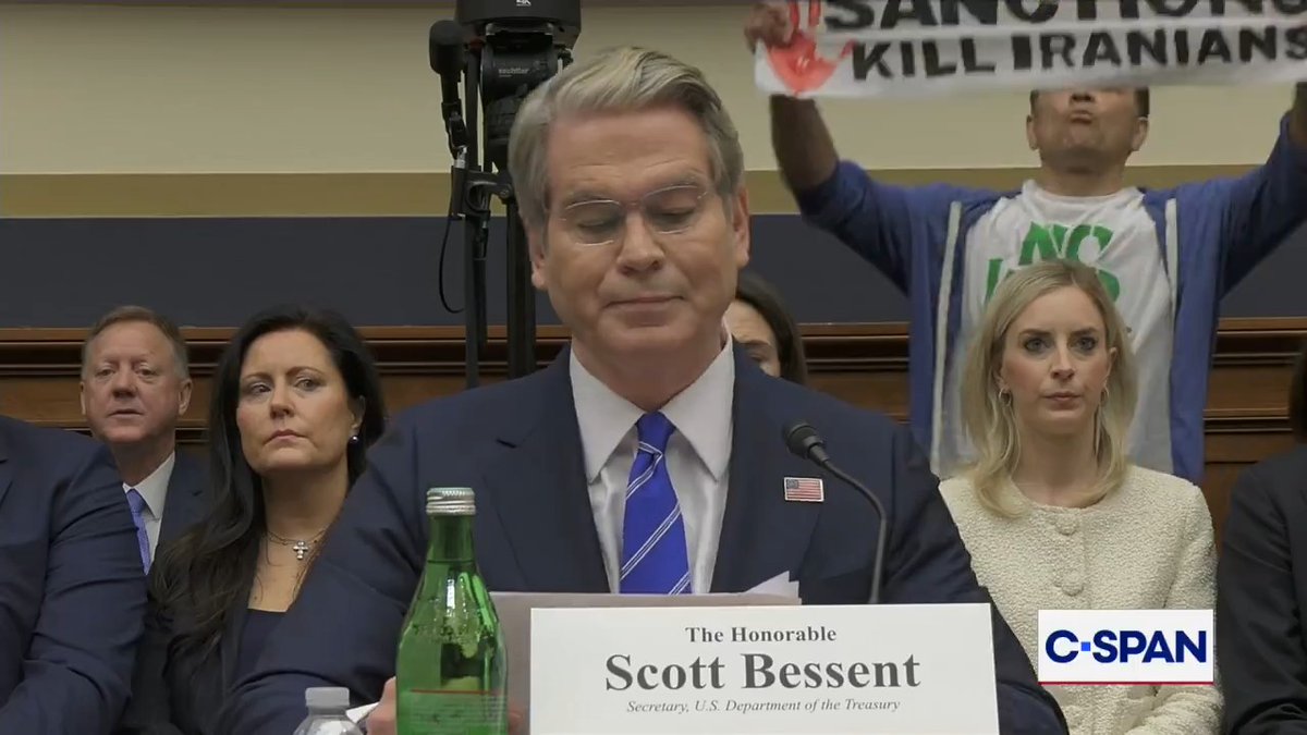 Protesters interrupt Treasury Secretary Bessent's opening statement.