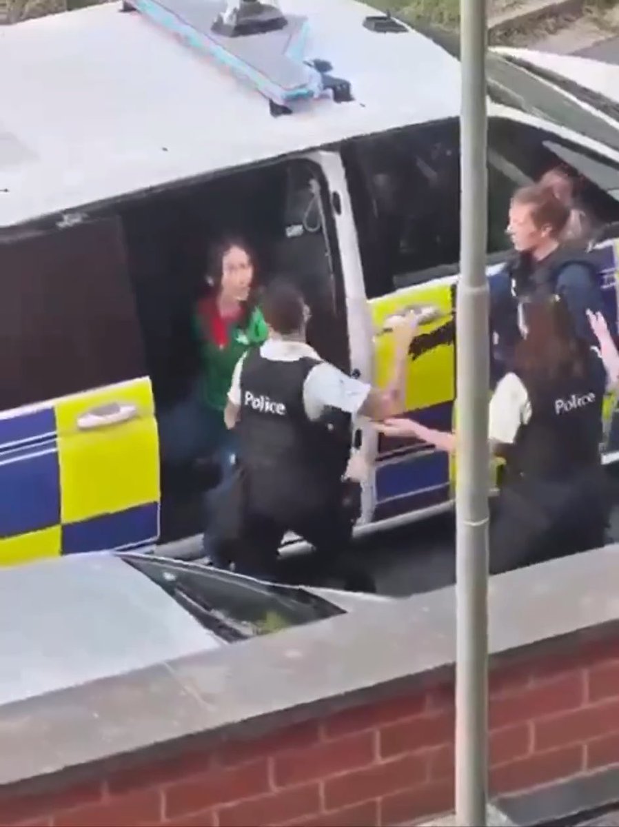 BELGIUM COP SLAPS WOMAN in CUFFS FEMALE OFFICERS DO NOTHING