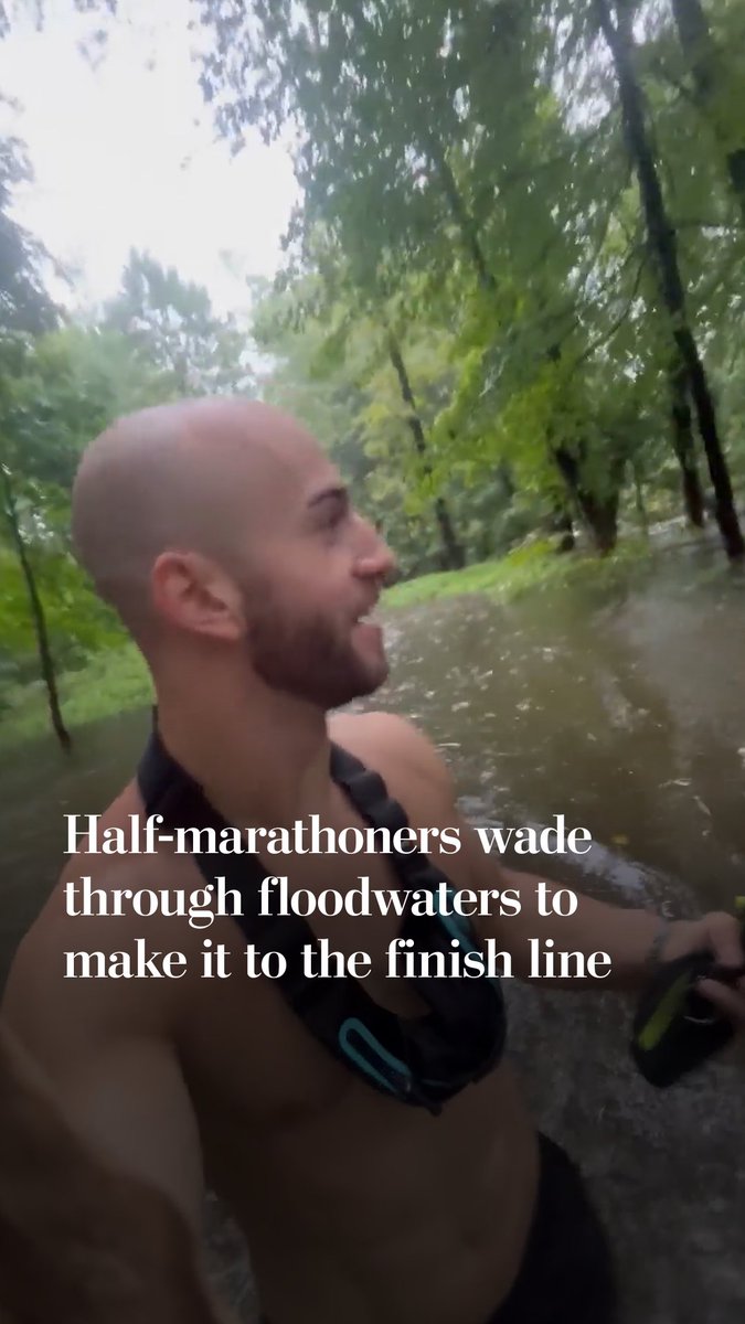 Half-marathon runners got stuck wading through floodwaters after heavy rain inundated the race’s route.