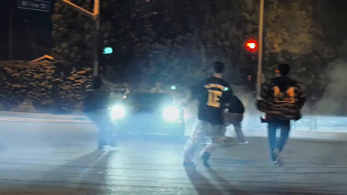 Dude hits someone with his car. So they beat up his car...
