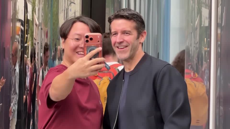 Apple fans lined up outside the company's Fifth Avenue flagship store in Manhattan as the new iPhone 18 went on sale, with customers citing camera upgrades and new artificial intelligence features among the biggest draws
