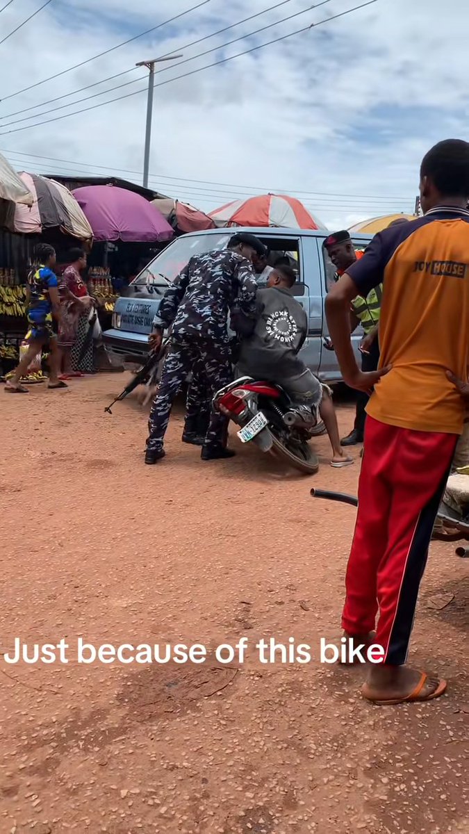 Between a young man riding a motorcycle and Nigeria Police officers in Enugu State.