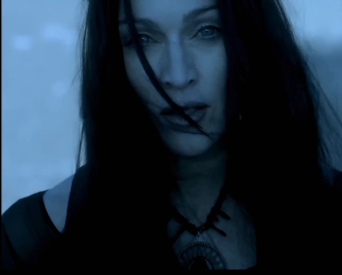 “Frozen” is from Madonna’s 1998 album Ray of Light. The atmospheric electronic ballad marked a dramatic departure from her earlier pop sound, blending ambient, electronica and trip-hop influences. It became a major international hit, reaching #2 on the Billboard Hot 100, #1 on the UK Singles Chart and #1 in several countries. The song's striking music video directed by Chris Cunningham, was filmed in the Mojave Desert and presented Madonna as a mysterious, otherworldly figure surrounded by dark landscapes and supernatural imagery. Its innovative visual effects, including Madonna transforming into a flock of black birds, became one of the most memorable videos of her career, winning the MTV Video Music Award for Best Special Effects in 1998. Drawing on the vocal technique and control she had developed while working on Evita, Madonna delivered a mature and haunting performance. The track was also the subject of a controversial plagiarism case in Belgium: in 2005, a court ruled that it infringed on a composition by Belgian songwriter Salvatore Acquaviva, leading to the song being banned from radio, television, and sale in the country. The ruling was eventually overturned in 2014, restoring the song's availability in Belgium.