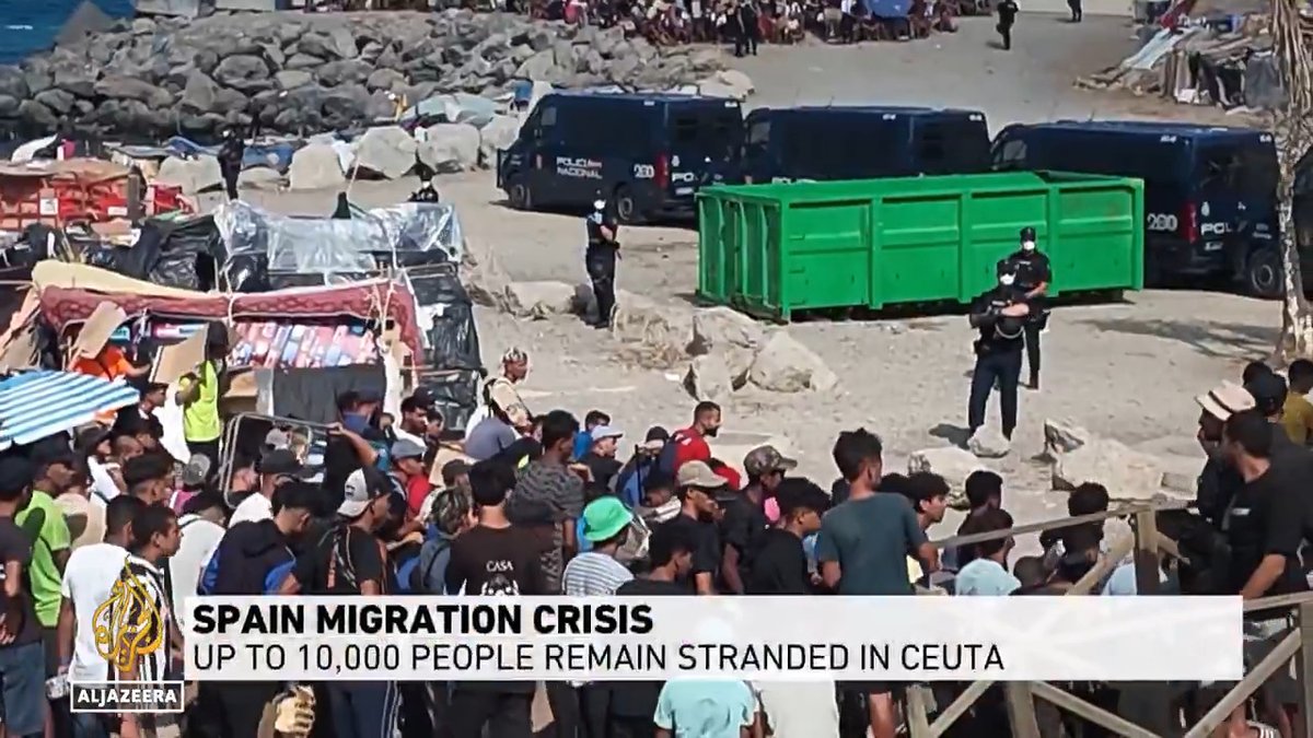 Fifty days into the migrant crisis in the Spanish territory of Ceuta, up to 10,000 people remain stranded, nearly half of them without shelter, grouped on the beach under armed police and made to wait for food. Al Jazeera's Peter Smith reports from Ceuta.