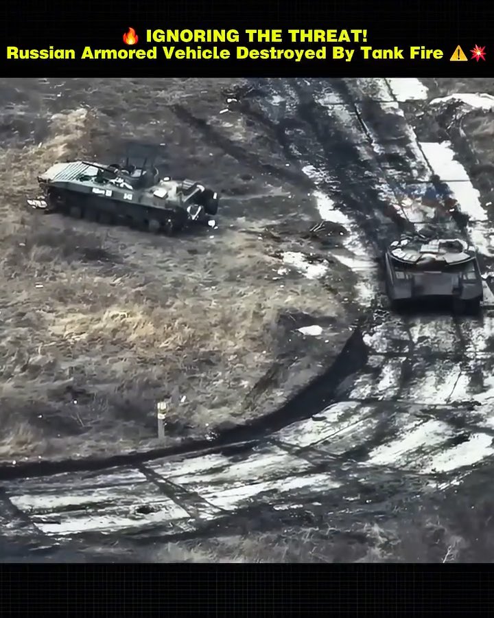 IGNORING THE THREAT! Russian Armored Vehicle Destroyed By Tank Fire The Russian armored vehicle continues advancing despite a Ukrainian tank positioned dangerously close by. The decision proves costly as the Ukrainian tank opens fire, striking the advancing vehicle and bringing it to a stop.