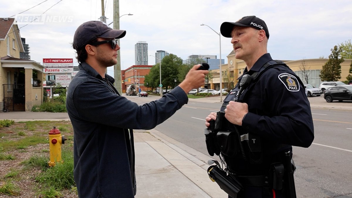 Open drug use in plain sight. A journalist with a camera? That's what got police attention. I was pulled off the property and asked for ID, while hard drug use continued feet away. This occurred outside a soup kitchen in Kitchener, Ontario.