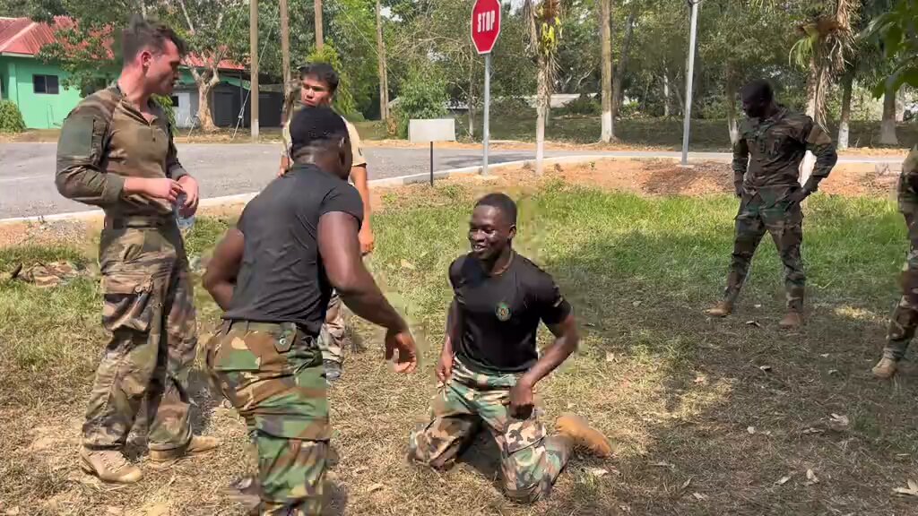 Raw display of strength as two Ghana Armed Forces colleagues, a Navy officer and a Jungler, engage in a show of physical power.