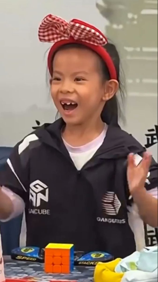 A six-year-old Chinese girl has set a new women's world record by solving Rubik’s cubes at an average pace of just over four seconds per cube.