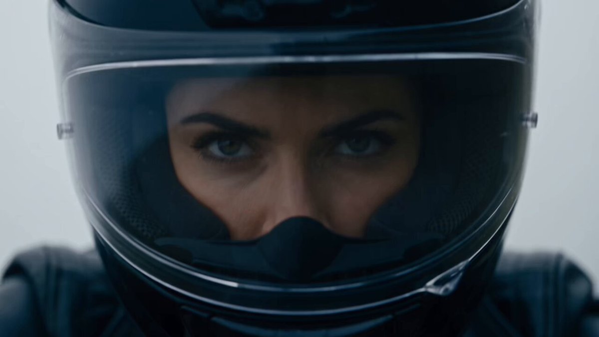 Some roads don’t take you somewhere. They become the destination. 🏍️🔥 Created using BytePlus Seedance 2.5 model on OpenArt #OpenArtAdAwards Prompt: Create a 30-second premium cinematic advertisement centered around a powerful heavy motorcycle and a striking adult female rider. The film should initially feel like a serious, high-budget cinematic action thriller — NOT a motorcycle commercial. For the first 20 seconds, create mystery and tension. The audience should wonder where she is going, what she is searching for, and why she is riding alone through such a dangerous environment. The motorcycle should feel heavy, powerful, expensive and mechanically realistic. The story should naturally build from: MYSTERY → PURSUIT → DANGER → DESTINATION → REVEAL → HERO PRODUCT Do NOT copy any existing advertisement, film, commercial, character, composition, scene or visual sequence. Create an entirely original story. VISUAL STYLE Photorealistic cinematic filmmaking. Premium high-budget automotive commercial production. Large-format cinema look with 35mm anamorphic photography. Deep cinematic contrast, natural skin texture, realistic motorcycle materials, metal, leather, glass and rubber. Realistic engine vibration, suspension movement and mechanical motion. Subtle film grain, natural motion blur and realistic environmental lighting. No cartoon appearance. No generic AI aesthetic. The motorcycle must remain physically believable and visually consistent throughout the entire film. Use dramatic wide landscapes contrasted with intimate close-ups. The color palette begins cold and desaturated and gradually transitions into rich, warm golden tones toward the final reveal. MAIN CHARACTER A strikingly beautiful adult woman in her late 20s. Dark flowing hair naturally tucked beneath a premium black motorcycle helmet. Confident, focused expression. Natural makeup. She wears a fitted black leather motorcycle jacket, dark riding pants, black gloves and realistic protective riding boots. Her appearance, clothing, helmet and motorcycle remain perfectly consistent throughout the entire film. She should look like a real professional rider, not a fashion model posing on a motorcycle. MOTORCYCLE A massive premium heavy motorcycle. Muscular proportions. Large engine. Wide rear tire. Heavy metallic frame. Premium black and brushed-metal finishes. Realistic suspension movement. Visible engine vibration. Powerful headlight. Subtle reflections across the fuel tank. The motorcycle should feel extremely powerful but elegant. Keep the exact motorcycle design consistent throughout every shot. SCENE 1 — THE UNKNOWN ROAD 0–5 SECONDS EXTREME WIDE CINEMATIC SHOT. A gigantic empty mountain road disappears into dense fog. Cold early-morning atmosphere. Wind moves across the landscape. Nothing else is visible. A distant engine roar slowly grows louder. A heavy motorcycle suddenly emerges from the fog. The female rider sits completely steady as the enormous machine moves through the empty road. Camera gradually moves closer. CUT TO an extreme close-up of her eyes inside the helmet. Focused. Unemotional. She looks toward something far ahead. Her hand subtly tightens around the throttle. The engine note rises. Transition naturally into the next shot while maintaining continuous motion and sound. SCENE 2 — THE PURSUIT 5–10 SECONDS Rapid cinematic sequence. The motorcycle accelerates through a winding mountain road. Low camera almost touching the asphalt. The rear tire throws tiny particles of water from the wet road. Close-up of her gloved hand twisting the throttle. The engine responds with a deep mechanical roar. Close-up of her boot shifting naturally through the gear. Close-up of the speedometer climbing. Wide aerial-style shot: The tiny motorcycle cuts through an enormous mountain landscape. She suddenly checks her rear-view mirror. Something appears to be following her in the far distance, but it is never clearly revealed. Music intensifies. She accelerates harder. Maintain continuous visual flow between shots with no black frames or unnecessary transitions. SCENE 3 — THE DANGER 10–16 SECONDS The weather suddenly becomes violent. Heavy rain begins. Lightning briefly illuminates the mountains. The road narrows dramatically beside a massive cliff. The rider slows. A large fallen tree partially blocks the road. She stops. For a moment, everything becomes quiet except the motorcycle idling in the rain. She looks at the obstacle. Then notices a narrow dirt path disappearing into the dark forest. A subtle confident smile. She turns the handlebars. The heavy motorcycle leaves the paved road. The massive tires crush wet gravel. Mud and water splash naturally around the wheels. The camera follows closely as she enters the forest. She disappears deeper into the darkness. SCENE 4 — THE DESTINATION 16–21 SECONDS The dark forest suddenly opens. The motorcycle emerges onto a spectacular mountain overlook. The storm has cleared. Golden sunlight breaks through the clouds. The entire visual atmosphere transforms from cold and desaturated into rich, warm cinematic tones. The rider slowly stops. She removes her helmet. Her dark hair falls naturally around her shoulders. She looks toward the enormous horizon. For the first time, the mystery becomes clear: She wasn't running from anything. She was searching for this place. She walks toward the edge of the overlook. Then slowly turns back toward the motorcycle. SCENE 5 — THE MOTORCYCLE REVEAL 21–26 SECONDS The music drops into a restrained, almost silent moment. The camera begins a slow, elegant cinematic orbit around the motorcycle. Golden sunlight glides across the metallic bodywork. Show beautiful macro details through fluid transitions: Engine components. Brushed-metal frame. Fuel tank reflections. Headlight. Leather seat. Brake assembly. Wide rear tire. Suspension. Small mechanical vibrations are visible while the engine idles. The rider sits back on the motorcycle. She starts the engine. A deep, powerful mechanical sound fills the mountain landscape. She gives the throttle one controlled twist. VOICEOVER: “Some roads aren't meant to be easy.” Brief pause. “They're meant to be remembered.” No text appears on screen during the story. SCENE 6 — FINAL HERO SHOT 26–30 SECONDS Ultra-premium cinematic hero shot. The woman sits confidently on the heavy motorcycle at the edge of the mountain overlook. Golden sunset behind her. Wind moves her hair and leather jacket naturally. The motorcycle dominates the foreground. The camera slowly pushes toward the front headlight. The headlight switches on. Hold for a powerful final composition. Only now introduce minimal elegant typography: BUILT FOR THE ROAD. After a brief beat, reveal the motorcycle brand name beneath it. Final sound: ONE DEEP ENGINE REV. CUT TO BLACK ONLY AT THE VERY END.