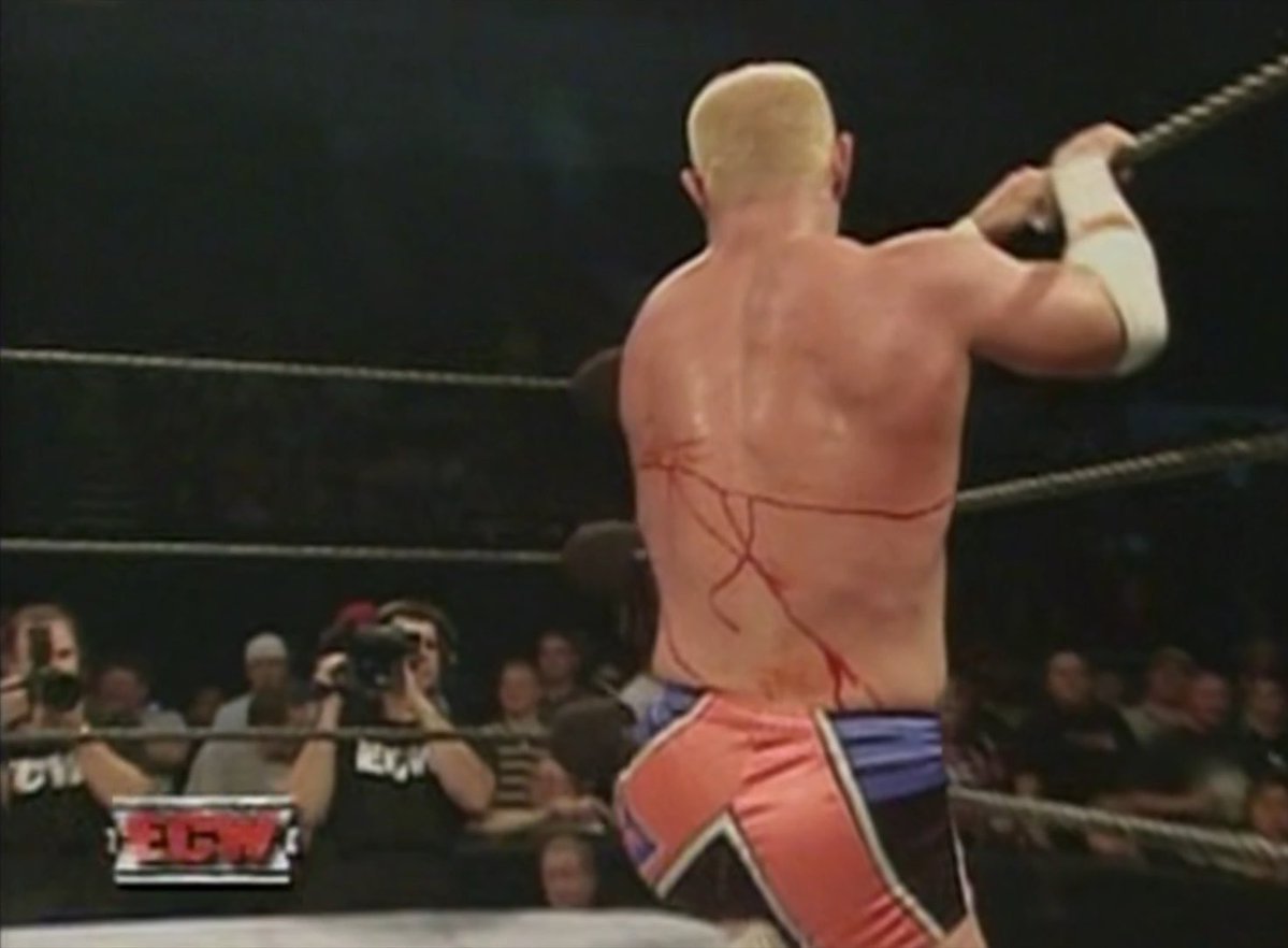 #OnThisDayInWWE 20 years ago on ECW: Bob Holly proves he's Hardcore and tough AF His back badly cut open by a table bump - and he somehow finishes his match against RVD!
