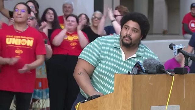 City Council candidate Misael Ramos approaches cheering crowd after release from Travis County Jail. Ramos was arrested Saturday morning in connection to a recent ICE protest.