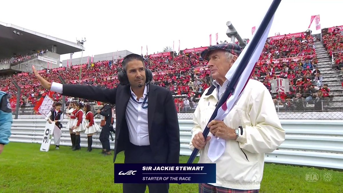 A special moment at Fuji 🇯🇵 Sir Jackie Stewart waves the Japanese flag as the grid gets set for six hours of racing. Join us live on FIAWEC+ to catch all the action! #WEC #6HFuji
