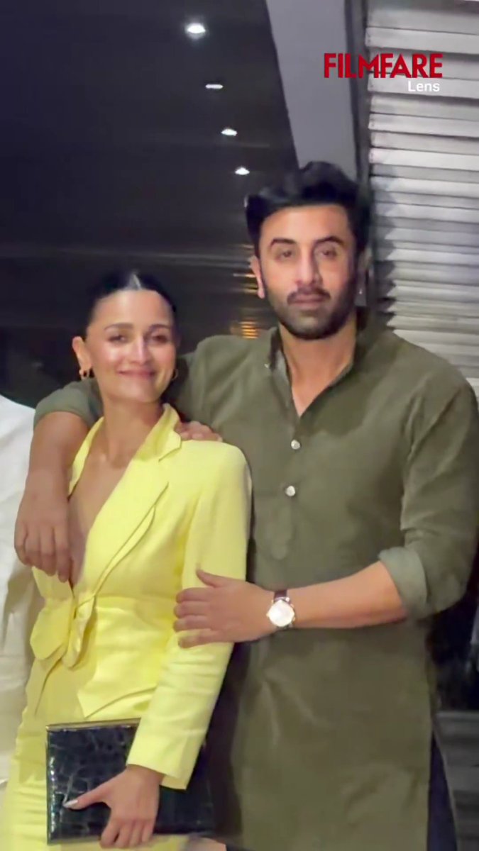 Seems Ranbir Kapoor Put his arm around Alia Bhatt that way to Cover up her deep neckline & exposure ?
