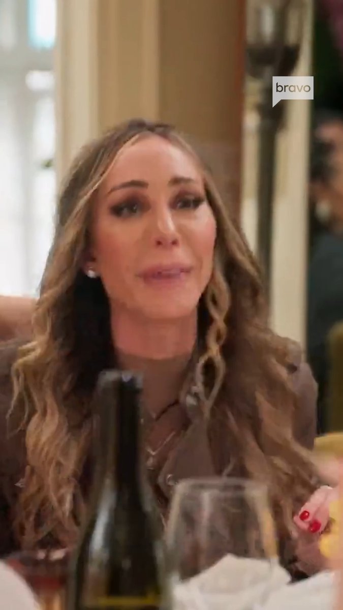Hailey is walking away from dinner after Erin's comparison. #RHONY