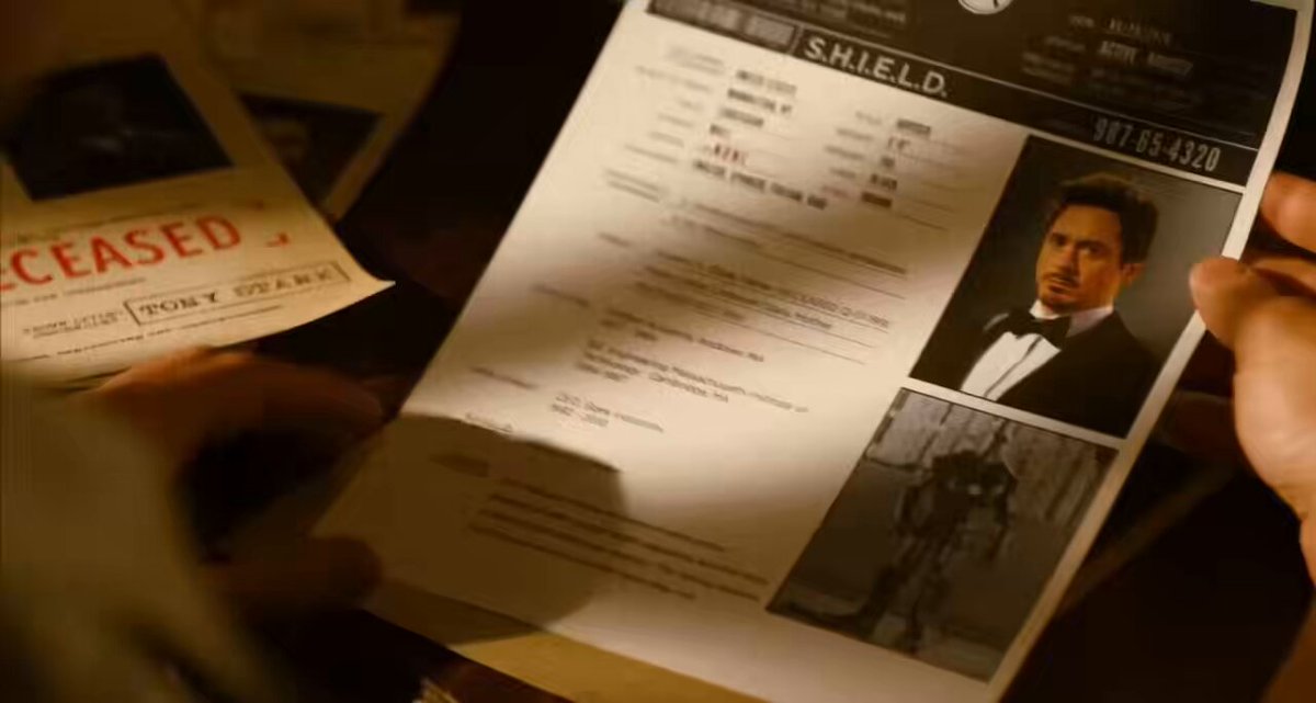 the deleted avengers (2012) scene where steve reads tony’s shield file and draws stark tower we still think of you