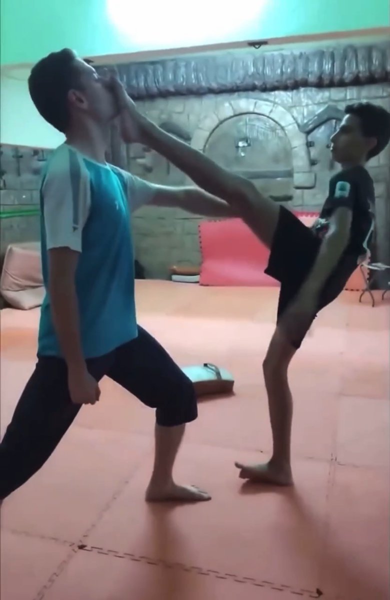 Training one of my students on a taekwondo kicking technique — working on raising the foot to face level with control, balance, and proper form. 🥋 Telegram