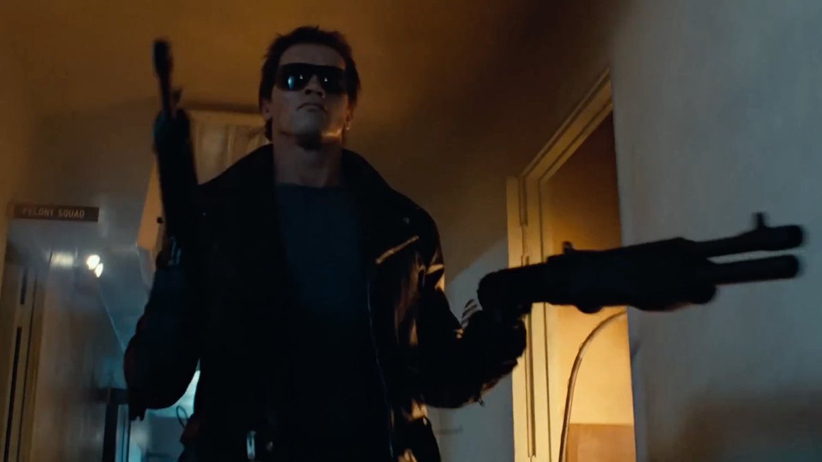 It walks in. The desk sergeant says wait. Then the lights go. 🎬 The Terminator (1984)