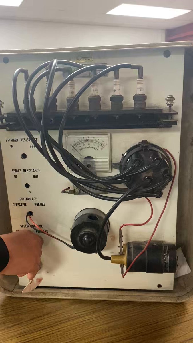 I teach high school auto shop and here is an old ignition trainer that I use. It is the old point style ignition and I still use it because the theory is still the same. It used points, which is a simple switch to make or break current to a high voltage coil. Newer electronic systems do the same only they use solid state components instead of a mechanical switch. Students always struggle trying to understand that the spark happens when the power is removed from the coil not when power is applied..