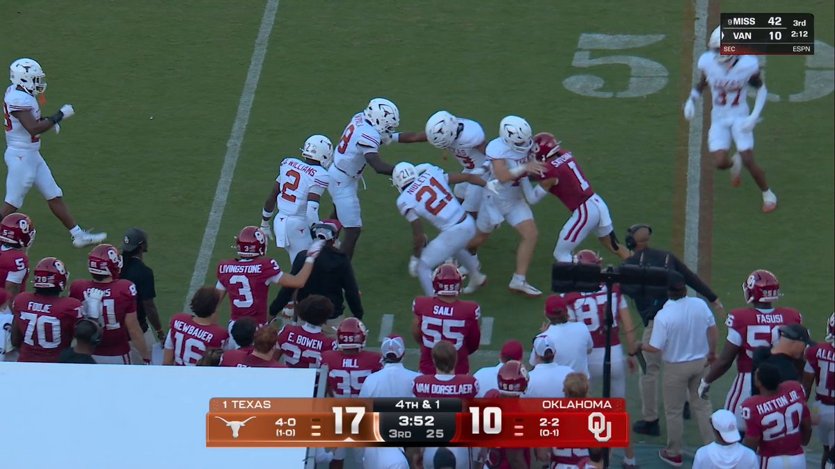 Texas tried to push the Oklahoma player on top of the football and a scuffle broke out 😯