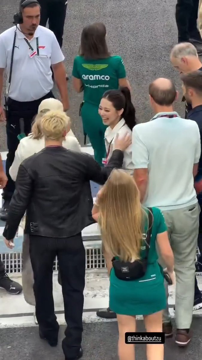 TZUYU and Stray Kids Bang Chan meeting and high fiving at the Singapore Grand Prix!