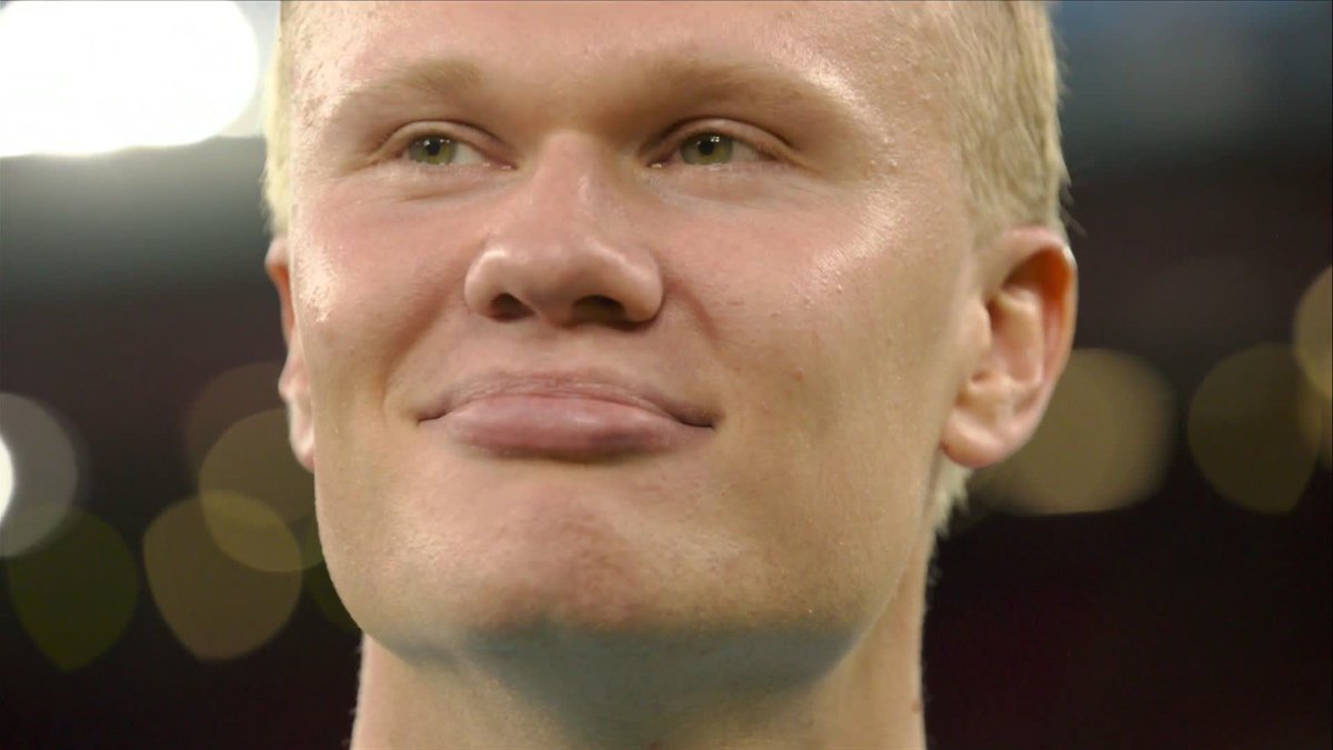 Erling Haaland soaks up the applause of the Man City fans at full-time at Anfield.
