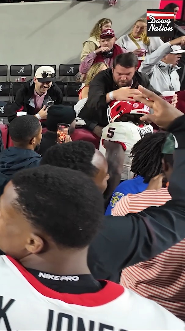 UGA linebacker Raylen Wilson was celebrating when he was shoved in the helmet by a fan after Georgia's win over Alabama. #DawgNation