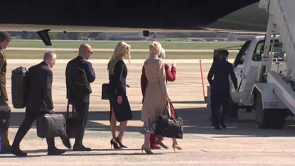 Natalie Harp and her large bag boards Bribe Force One