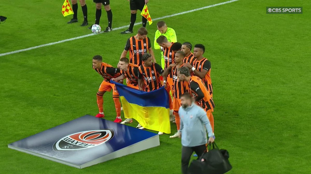 🇺🇦 1,700 miles from home 🇺🇦 Shakhtar Donetsk hold their nation's flag as they take the field at Stamford Bridge. Chelsea's home stadium will act as Shakhtar's home ground for their European fixtures this season because of the ongoing war in Ukraine.