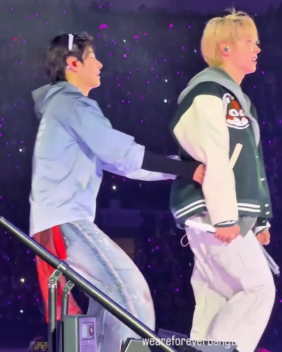 taehyung bringing hoseok over to someone with a sign for him how sweet