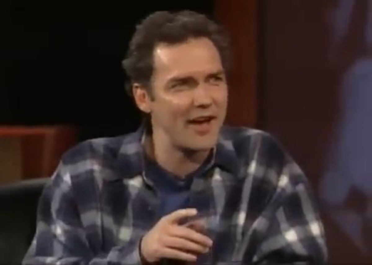 Norm Macdonald's real gift is making even an unexpected interruption feel like the setup to the next punchline, you just have to think twice He can make a conversation look completely out of control while quietly turning every interruption into another joke. On Dennis Miller Live, he starts with Viagra and Bob Dole, detours into David Spade’s sex life and wanders into George Michael’s arrest. Then, almost casually, he brings up the NBC executive who fired him. The apparent chaos has a destination. The fun is watching how he gets there.