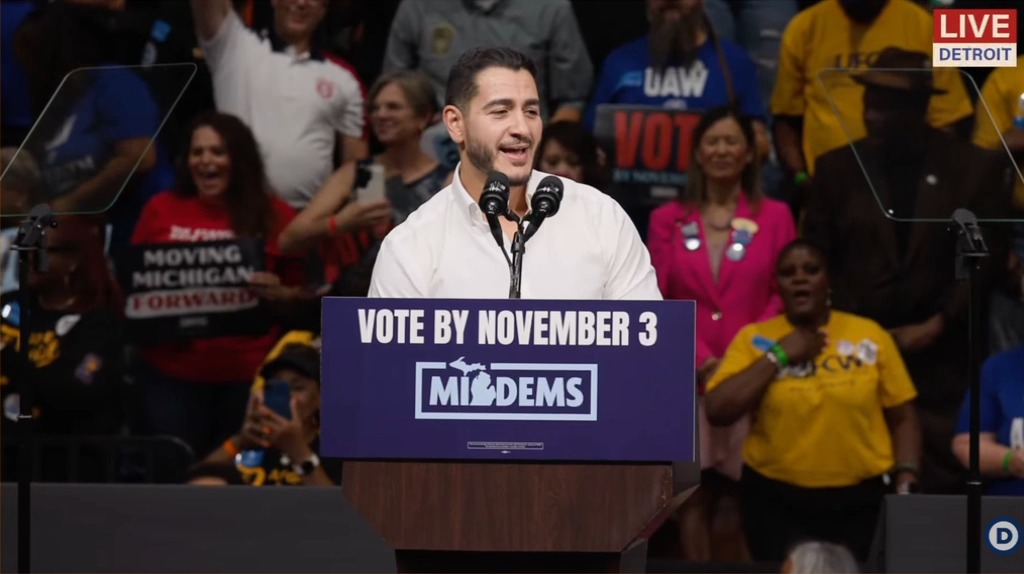 Obama daps up Abdul El-Sayed as he greets a fired-up crowd in Detroit