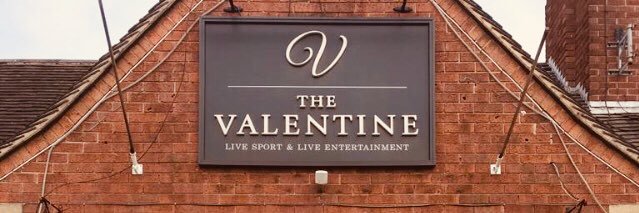 an Aintree Villa team - not saying which one's banner