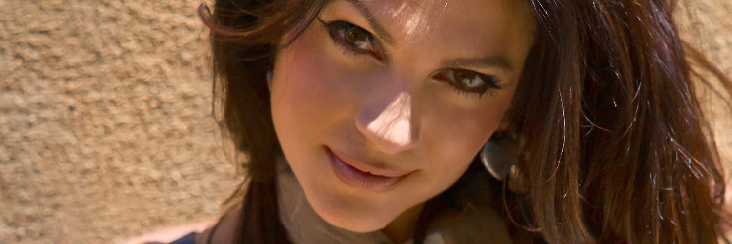 Denise Milani's banner