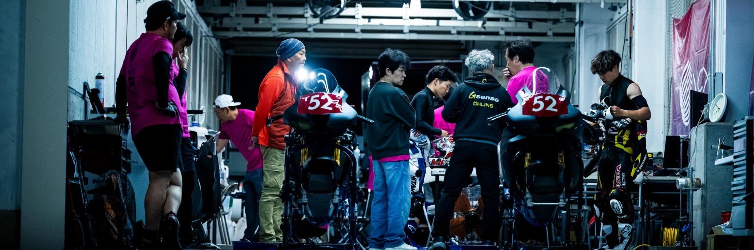 NCXX Racing with RIDERS CLUB's banner
