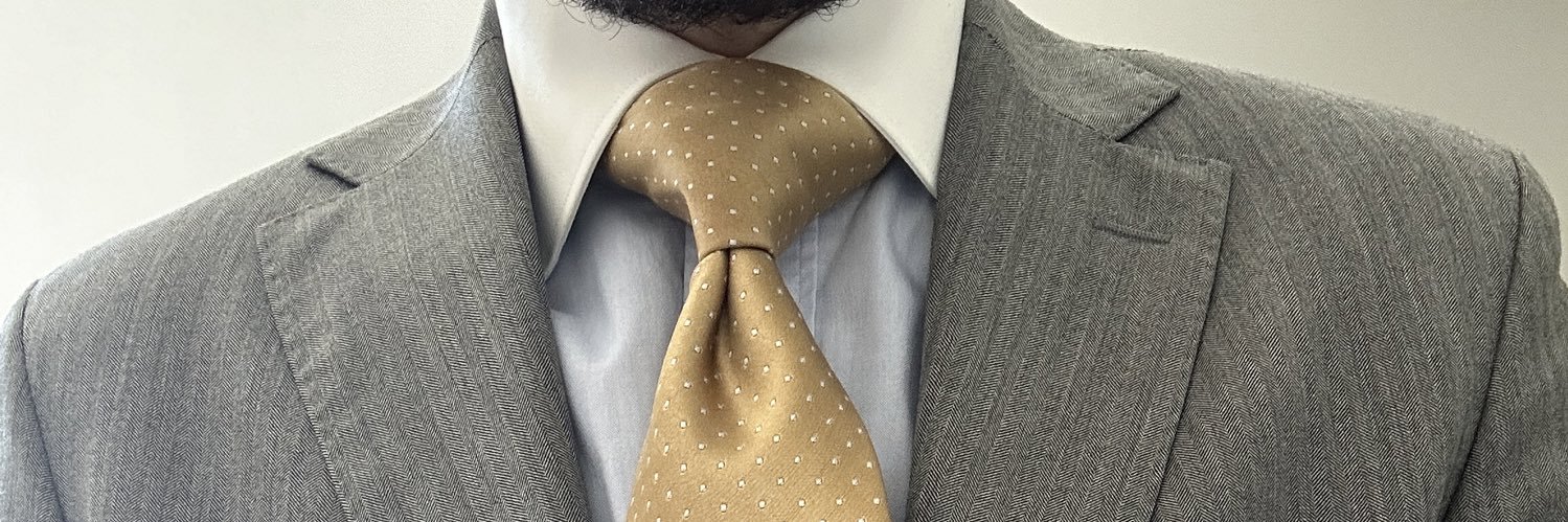french suit and tie's banner
