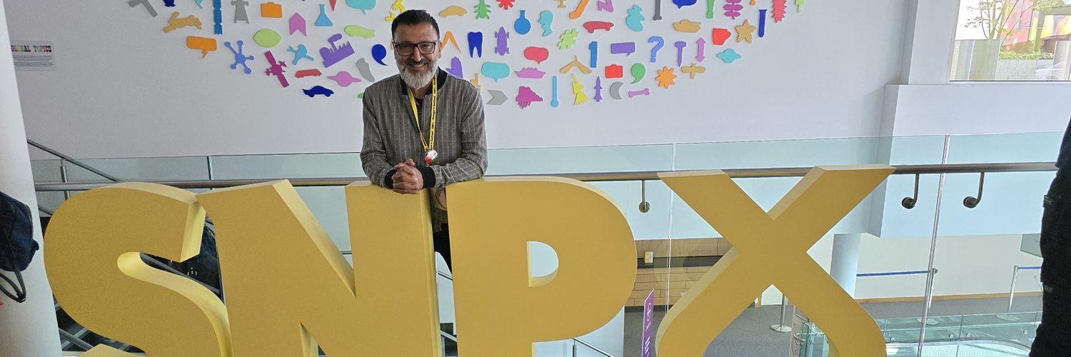 Amjid Bashir SNP's banner