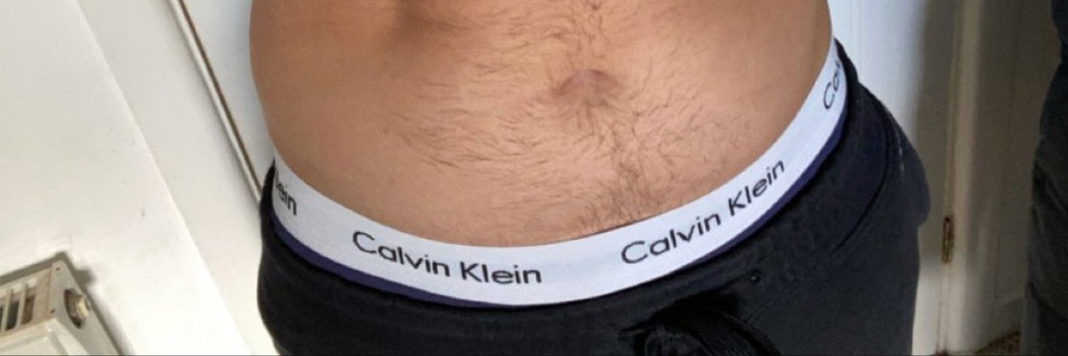 Guys in Calvin Klein Underwear 23K's banner