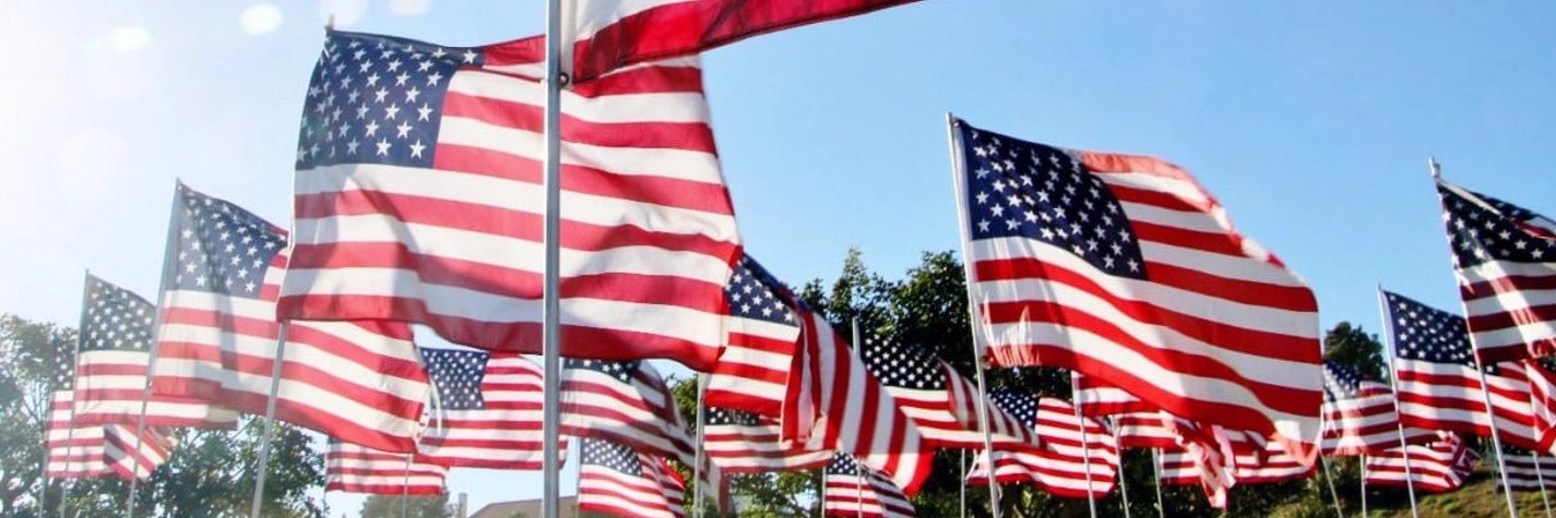 IN TRUMP WE TRUST's banner