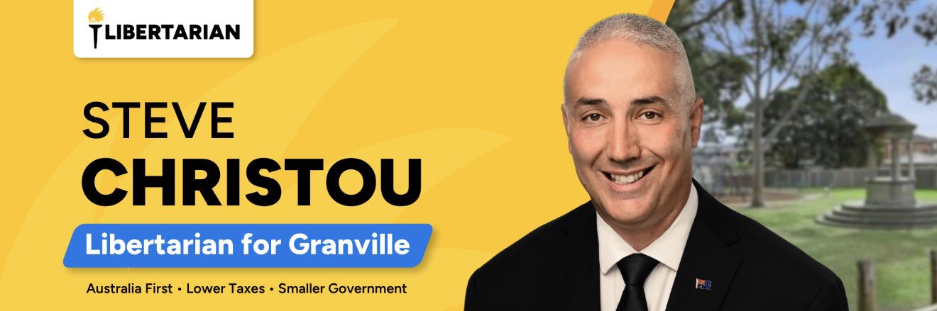 Councillor Steve Christou Libertarian Party's banner