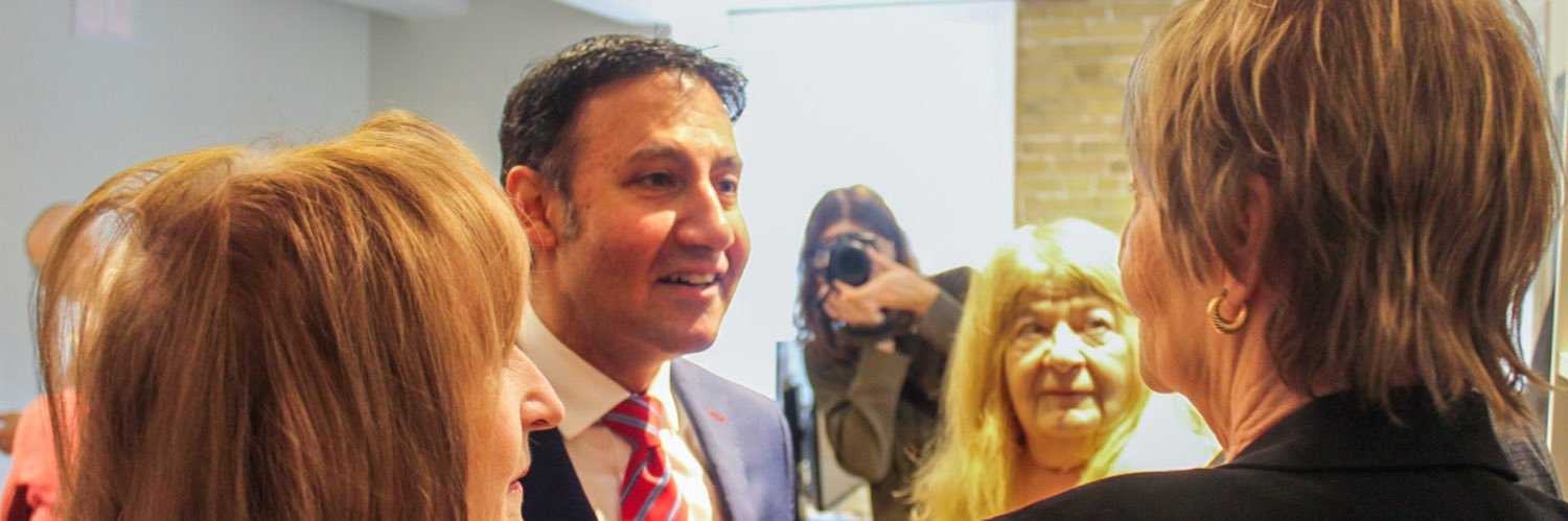 Arif Virani's banner