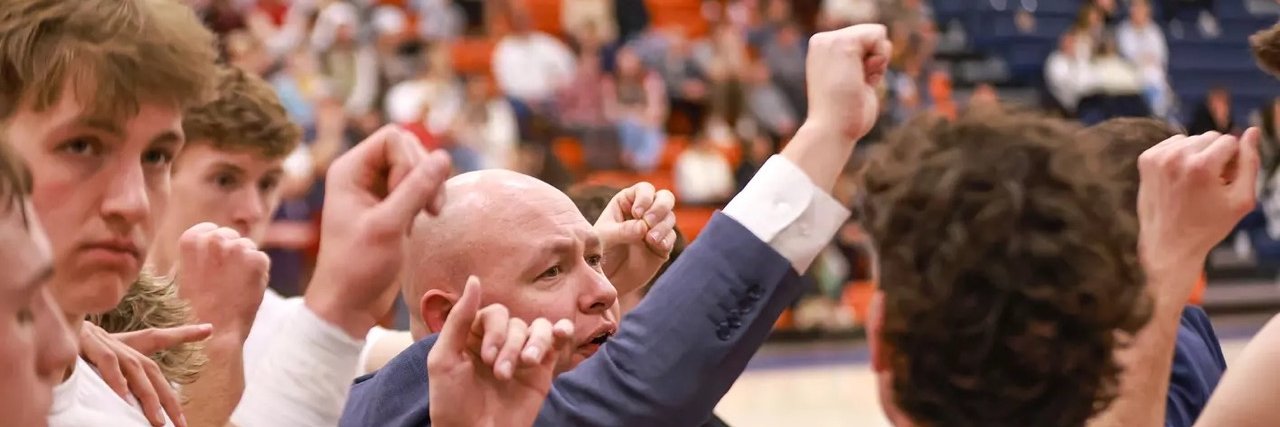 Coach Andrew May's banner