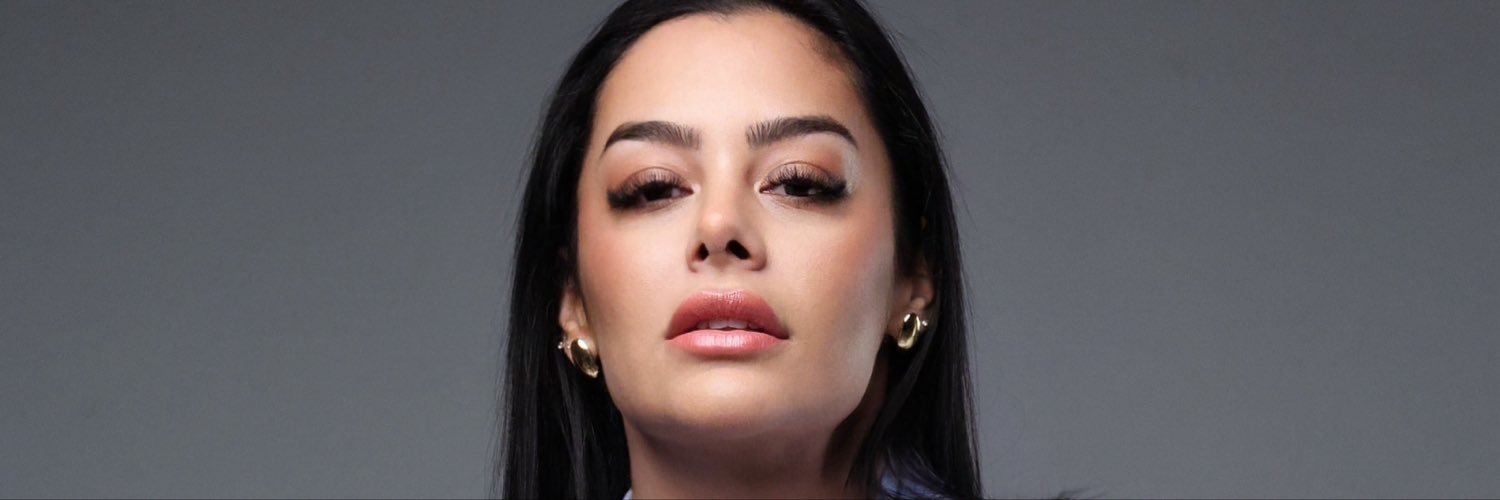 Larissa Riquelme's banner