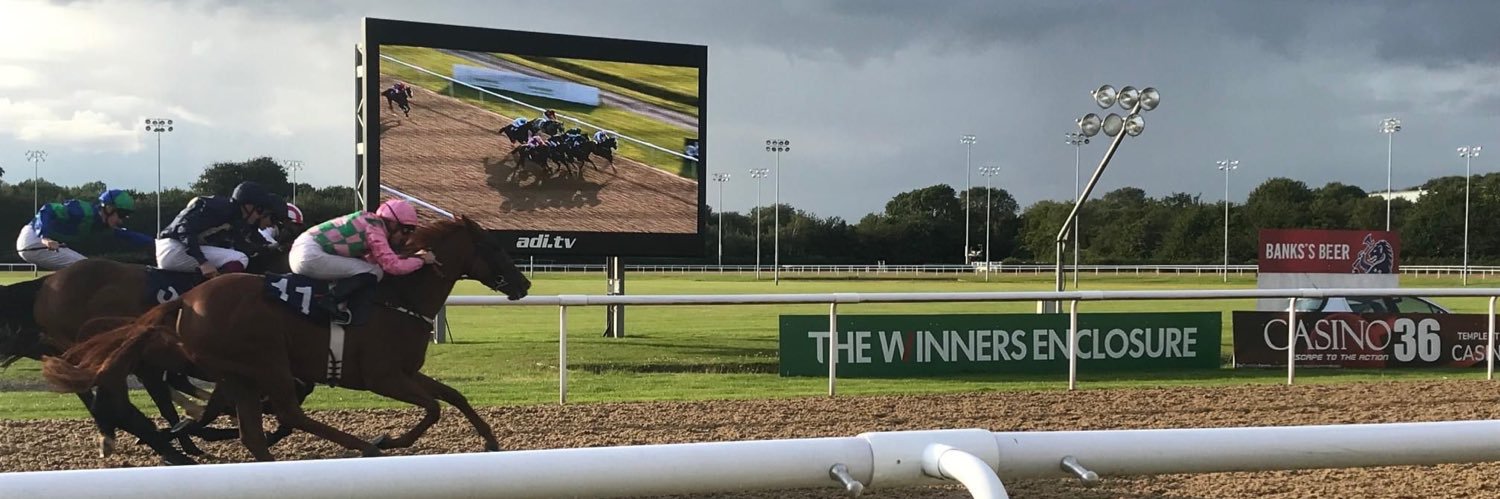 The Winners Enclosure's banner