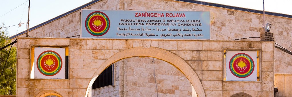 Zanîngeha Rojava / Rojava University's banner